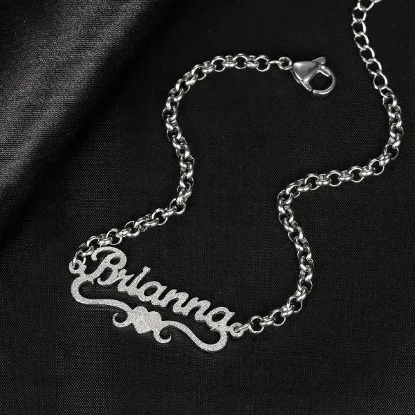 ARMBAND MIT NAMEN IN SILBER UND GOLD : IHR PERSÖNLICHES FUNKELN - Königlicher Siegelring