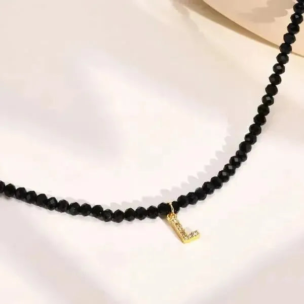 KETTE MIT BUCHSTABEN AUS DIAMANT PERLE BESTEHEND AUS INITIALIEN - Königlicher Siegelring